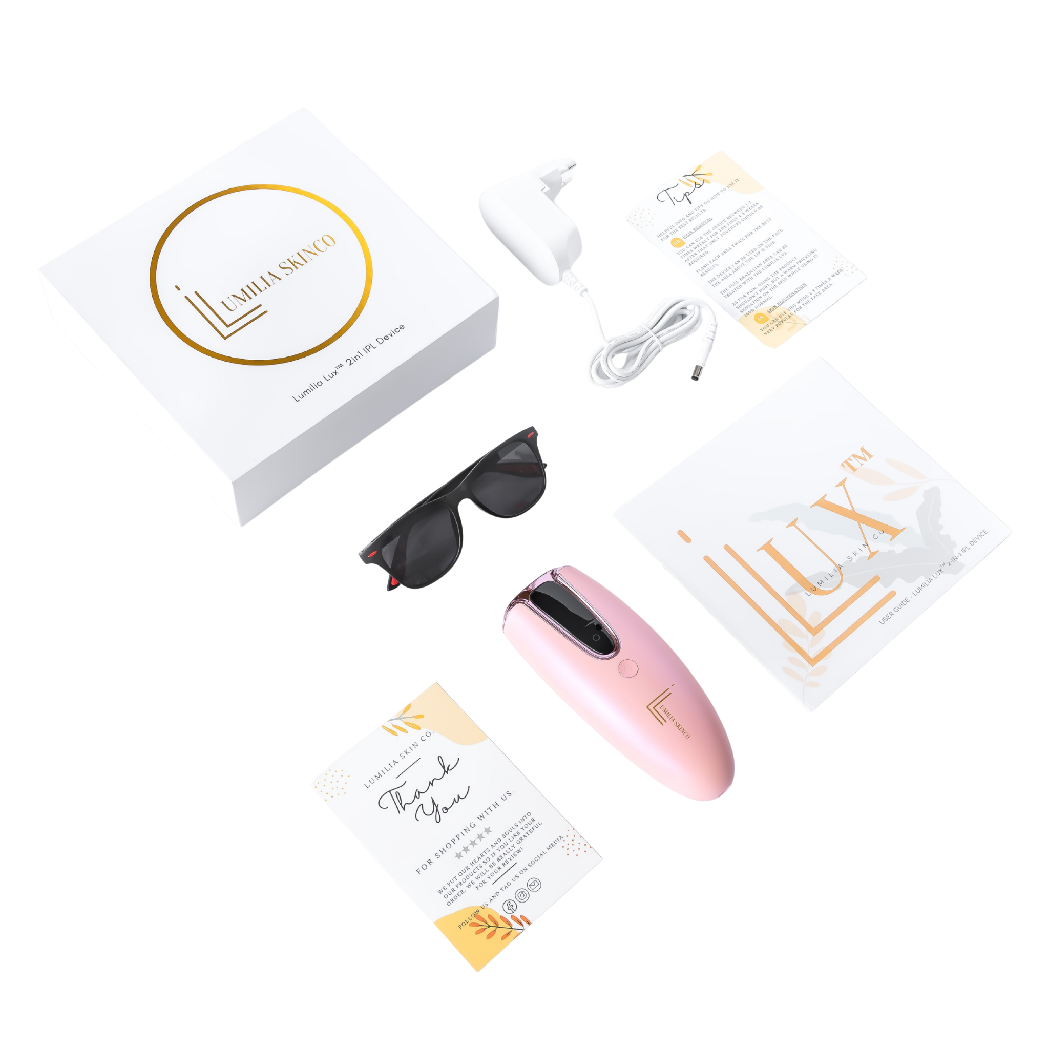 Pink Lumilia Lux™ 2-in-1 IPL device with rose gold trim and complete kit — premium branded box, protective sunglasses and accessories included. FDA cleared and NRCS certified for South Africa.