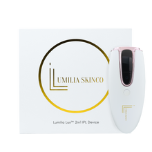Load image into Gallery viewer, White Lumilia Lux™ 2in1 IPL laser hair removal and skin rejuvenation device with rose gold trim, standing upright beside premium Lumilia Skin Co. packaging. FDA cleared and NRCS approved for safe, at-home use in South Africa and globally.
