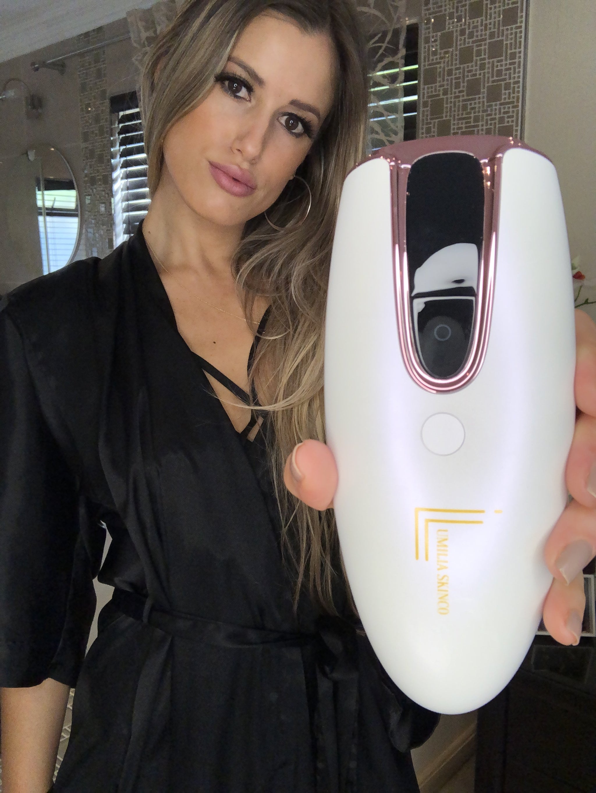 Woman holding the Lumilia Lux™ 2-in-1 IPL Laser Hair Removal & Skin Rejuvenation Handset – premium at-home device for smooth skin, visible results, safe & effective.